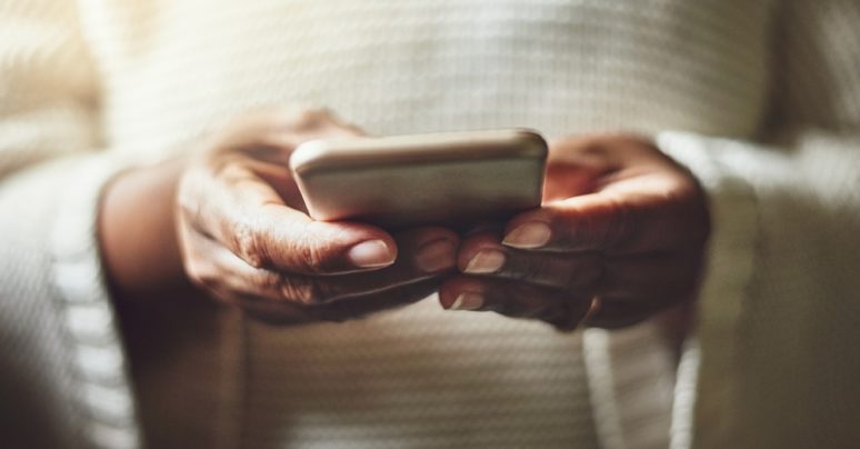 black woman's hands holding phone black woman's hands holding phone